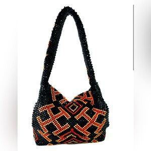 Tory Burch orange and navy wooden beaded handbag